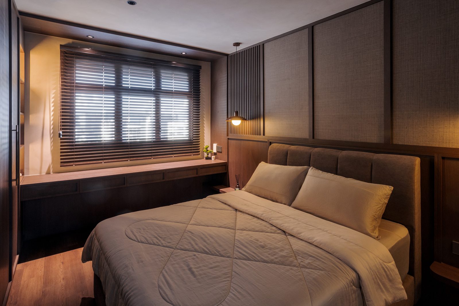 Junior bedroom with bay window study nook and built-in cabinetry