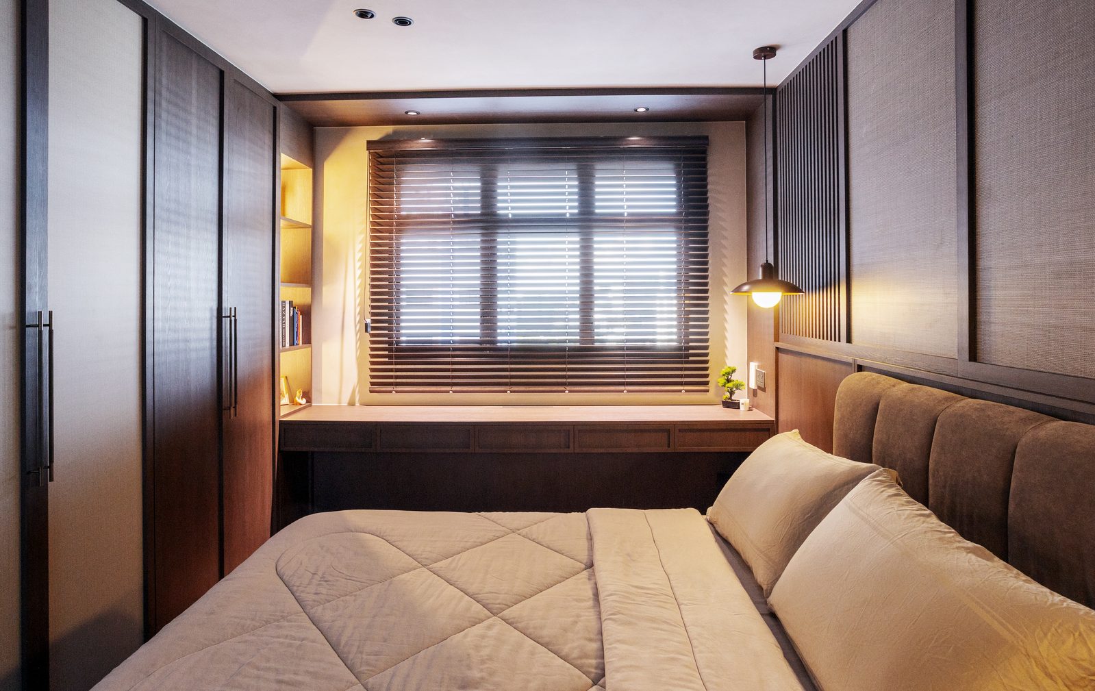 Second bedroom with built-in wardrobes and bay window reading area