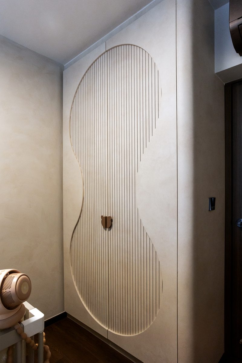 Bespoke curved wardrobe door with vertical timber slat detail