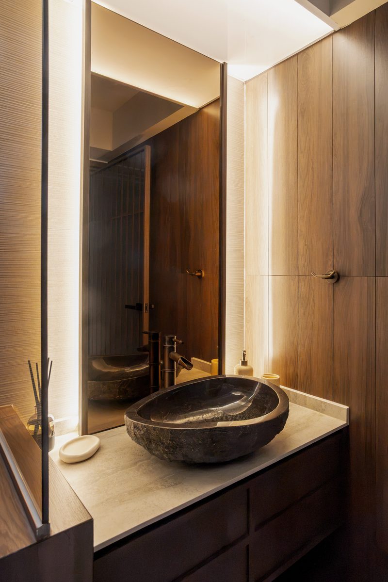 Master bathroom with natural stone vessel sink and brass bamboo faucet